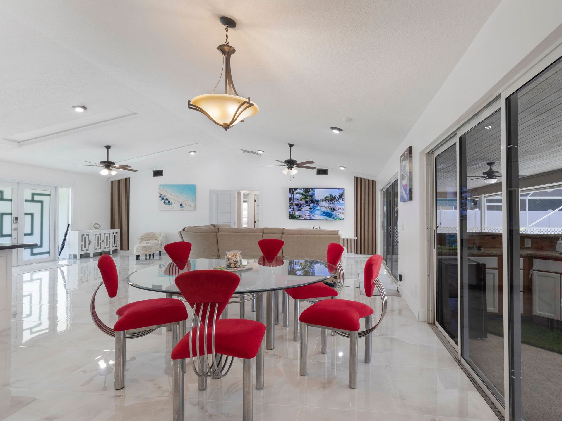 Open plan living and dining room with marble floors